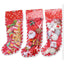 Christmas pet toys set packaged in red candy cane stockings with festive small plush and plastic cat chew toys