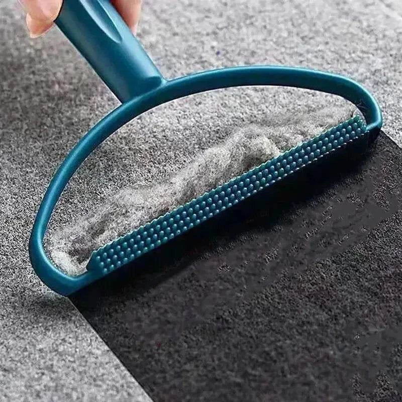 Portable clothes lint roller removing pet hair and lint from fabric surface